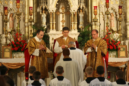 Father Eichman Administering Communion