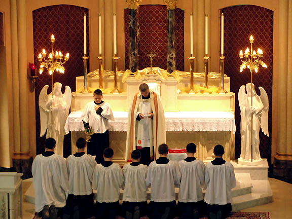 The Day before, Fr. Devillers, Chaplain, enrolls 7 altar boys in the Archconfraternity of St. Stephen.