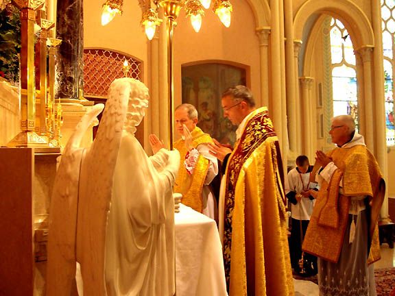 The Bishop, assisted by Fr. Devillers, during the Preface.