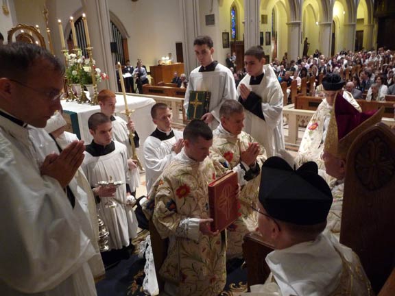 Priests and Servers Surrounding Bishop Serratelli at the Throne
