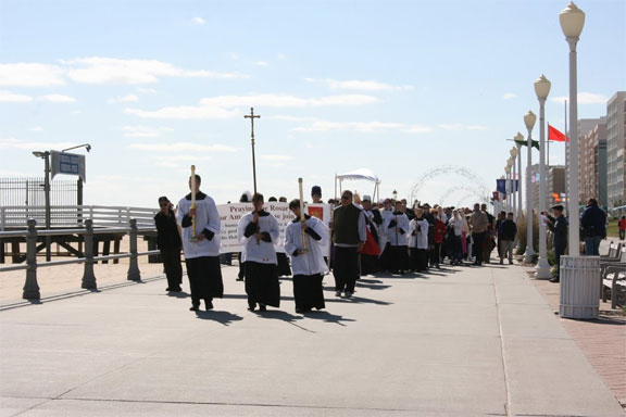 The procession moves onto the Virginia Beach Boardwalk