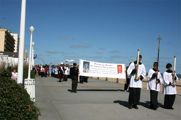 The procession returns to Star of the Sea, completing the Rosary and the singing hymns.