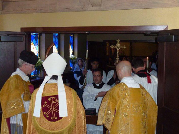 Fr. McNeely Kneels Before Bishop Soto to Begin Installation