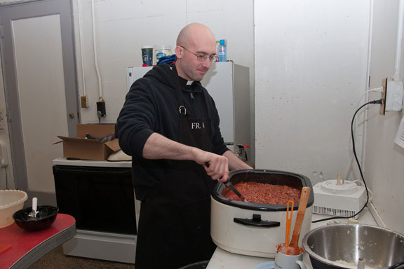 Father Prepares a Larger Cooker of Sauce