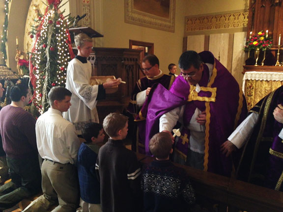 Father Jose Zepeda, FSSP, Distributes Candles at St. Michael's in Scranton
