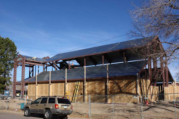 Installation of the framing walls and initial roof is complete.