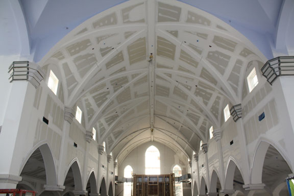 The finished vaulted ceiling being installed, with rear windows framed in.