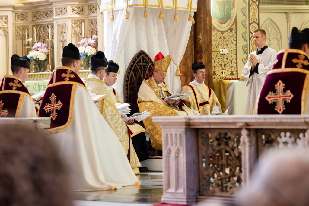 Archbishop Lori in choir with priests and deacons during Vespers